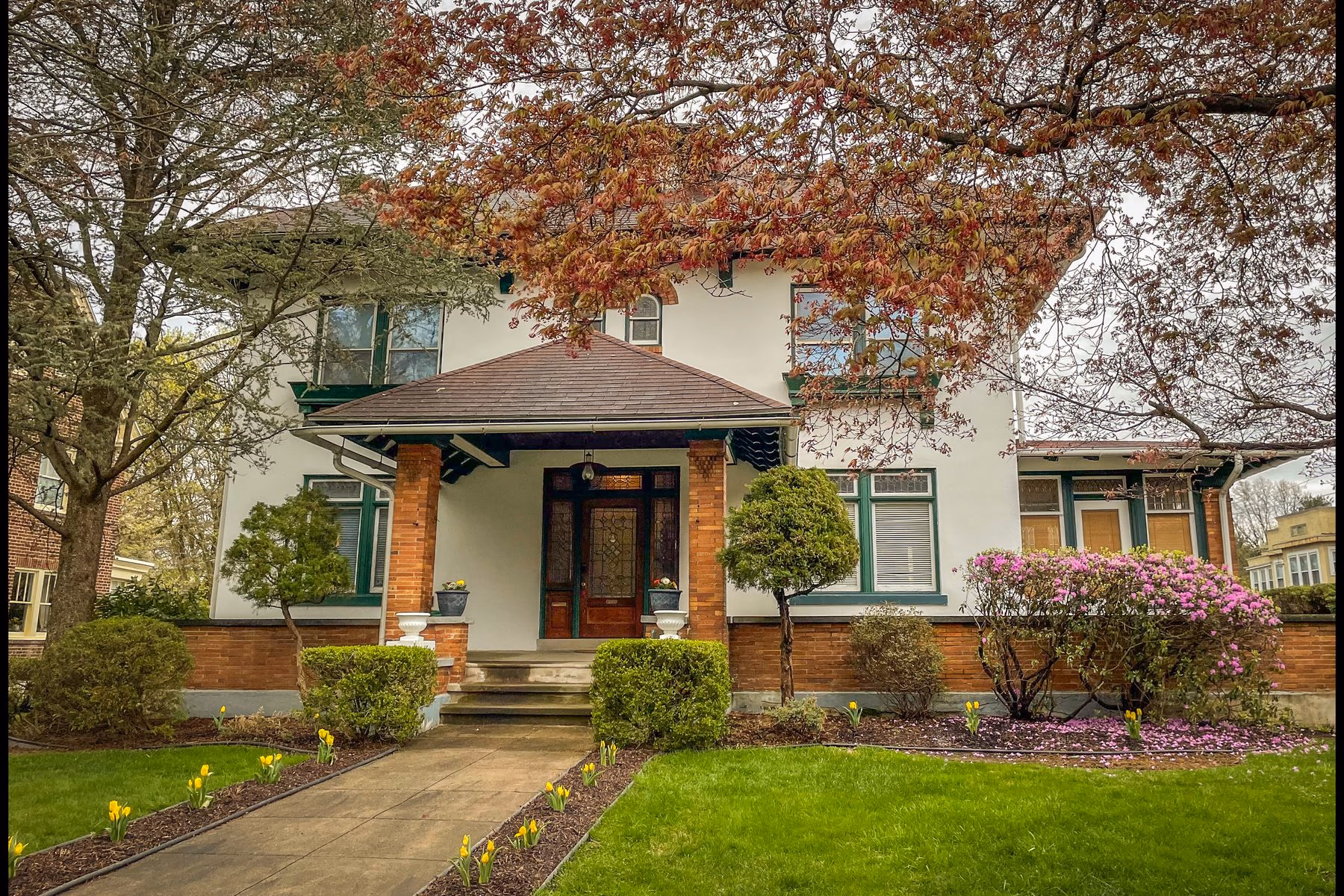 The practice: a house with a porch and a flowering garden at 501 Carsonia Ave, Reading